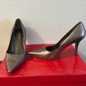 Brand: Nine West; silver stiletto lady’s heels